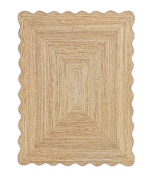 A beige-colored, textured jute area rug with a wave scalloped edge.