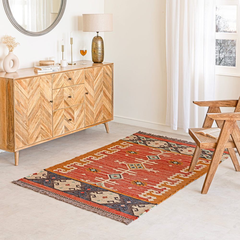 Wool jute kilim rug with traditional pattern on a white background.