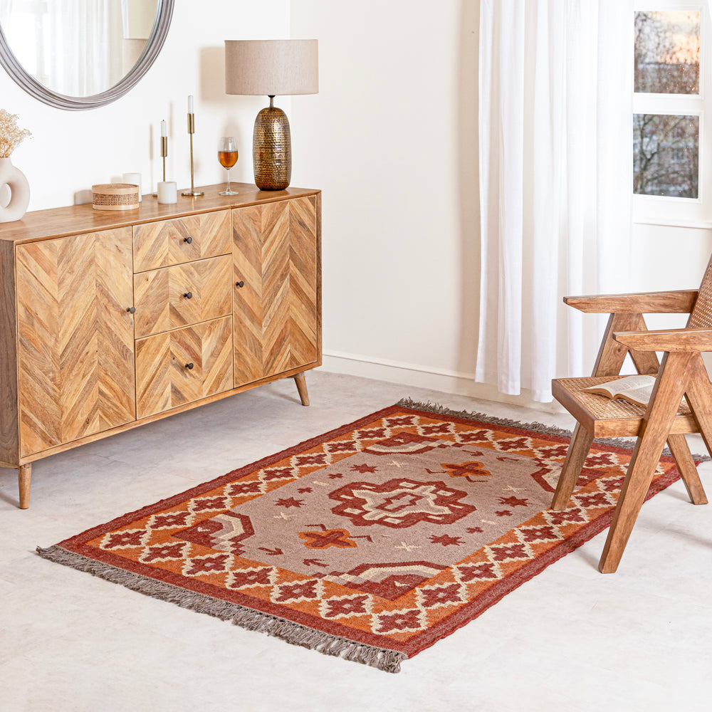 Decorative jute kilim rug with geometric pattern on a plain background