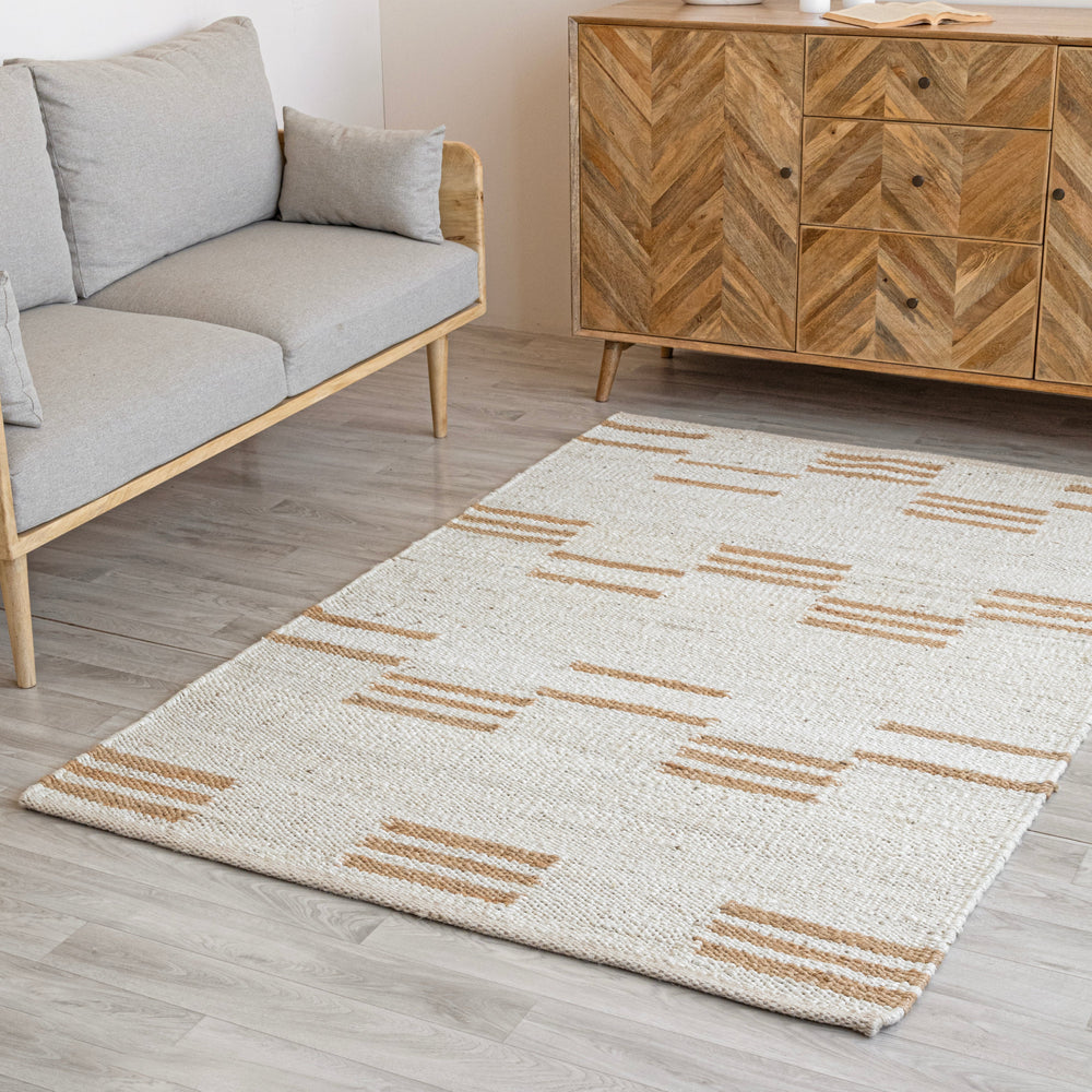 Textured off white jute rug with a pattern of horizontal lines on a white background