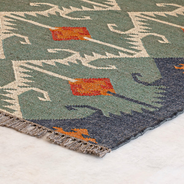 Close-up of a Kilim Jute rug with geometric design on a white background